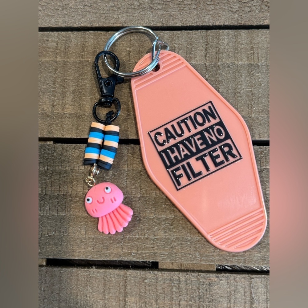 Pink Keychain with Caution Message and Octopus Charm